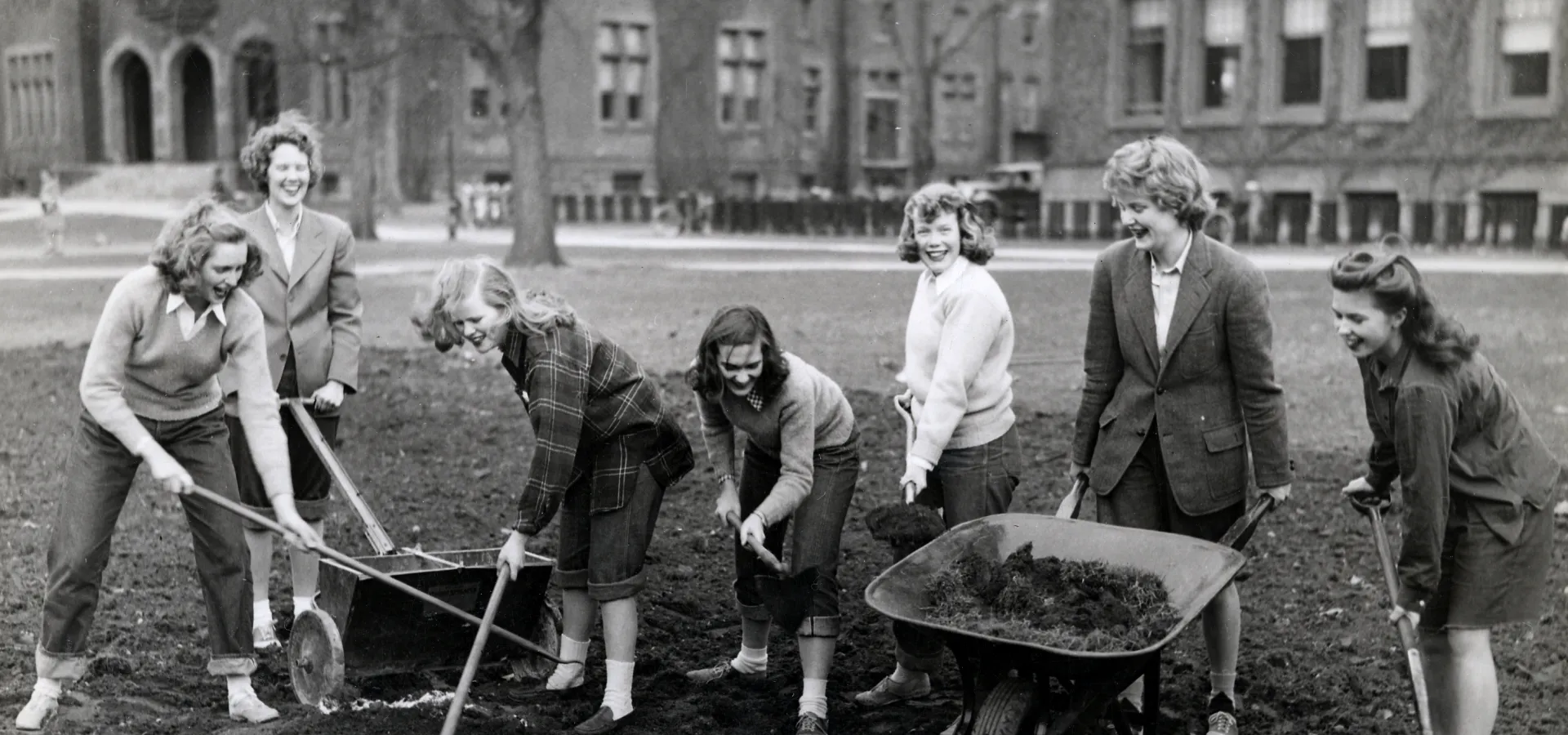 Students making a Victory Garden between Library and Burton Hall, 1943