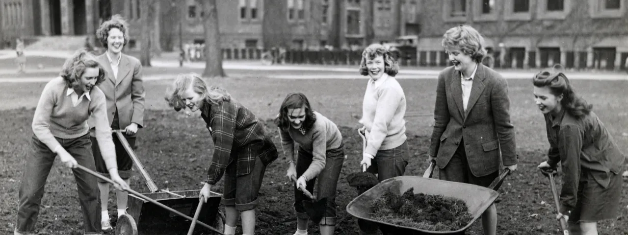 Students making a Victory Garden between Library and Burton Hall, 1943