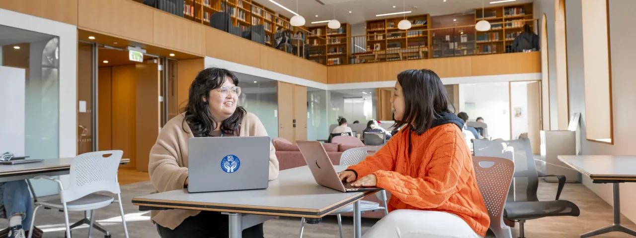 Xochitl Quiroz working with a student in the Learning Commons