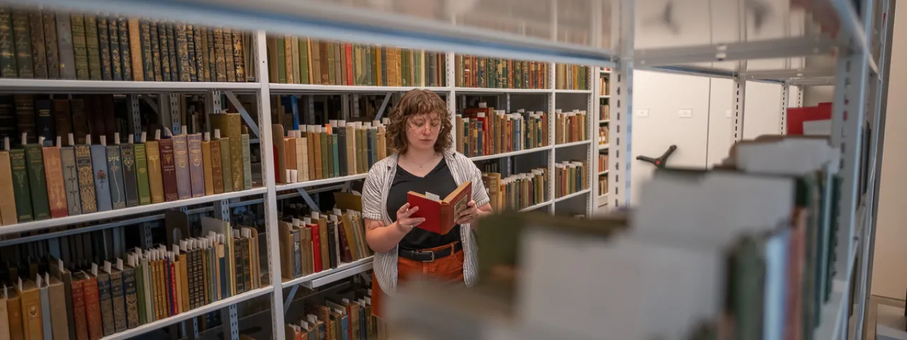 Student in the Special Collections stacks