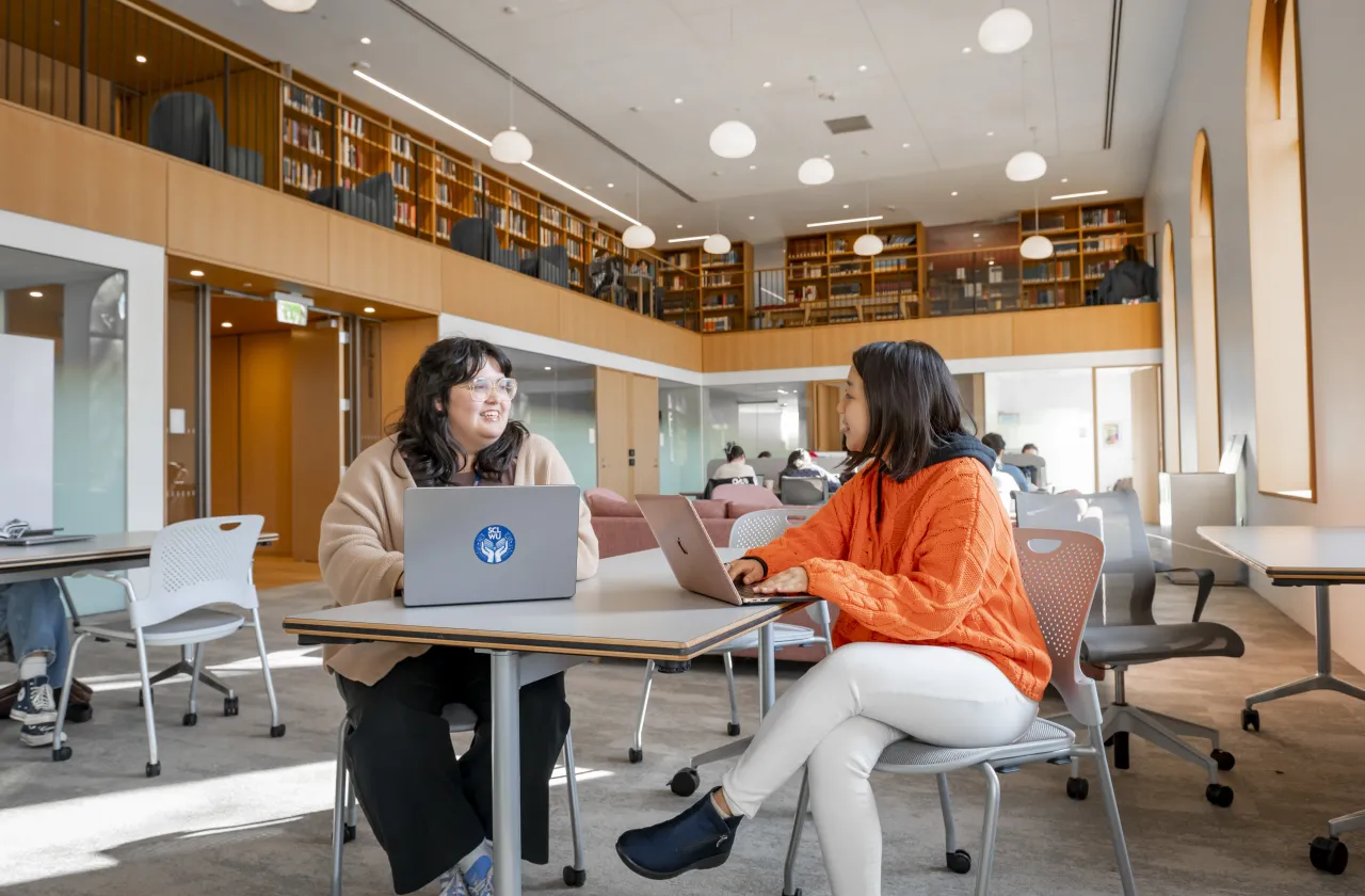 Xochitl Quiroz working with a student in the Learning Commons