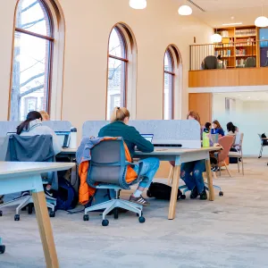 Students working at desks in the Learning Commons