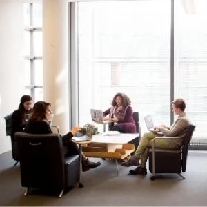 students sitting around a table in a library