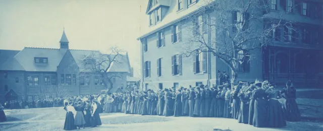 Students waiting for opening of Alumnae Gym doors for a basketball game, c1895