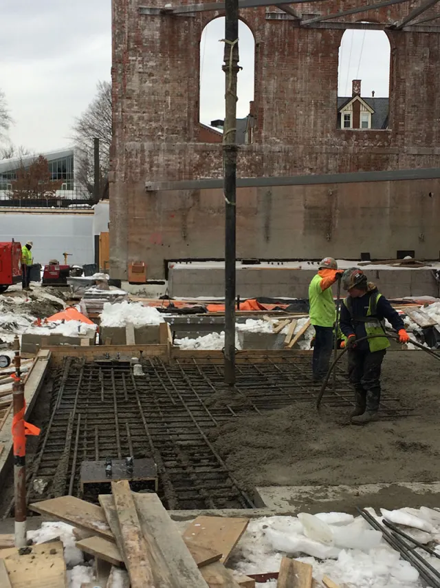 Placing a section of concrete mat slab in the core of 1909.