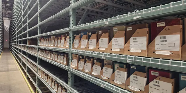 Shelves in the Library Annex showing re-size trays and shelves filled.