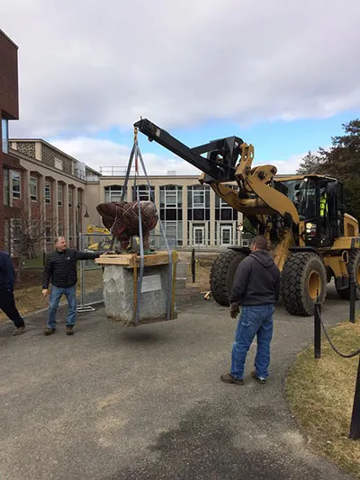 Sculpture being moved outside Wright Hall