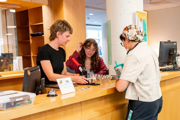 Hillyer Library service desk staff and students