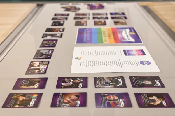 Display case of Queer Clergy Trading Cards