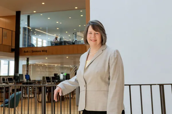 Susan Fliss standing in front of the Oculus in Neilson Library