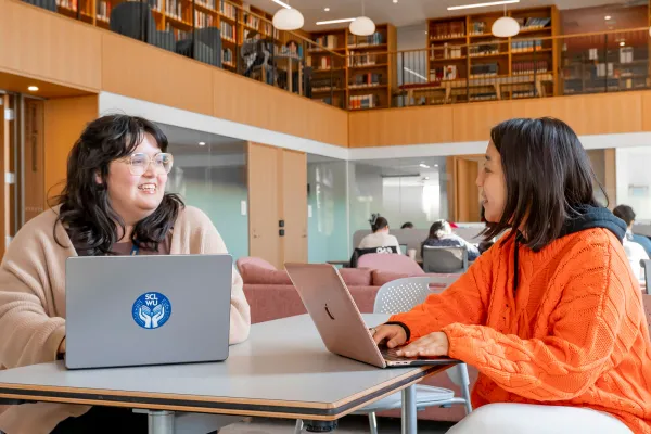 Research librarian working with student in Learning Commons