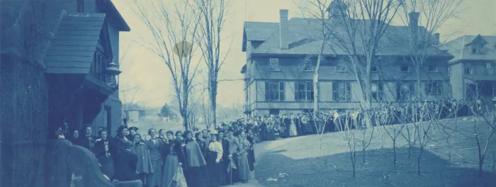 Students wait in line to get into basketball game at Rally Day, 1900.