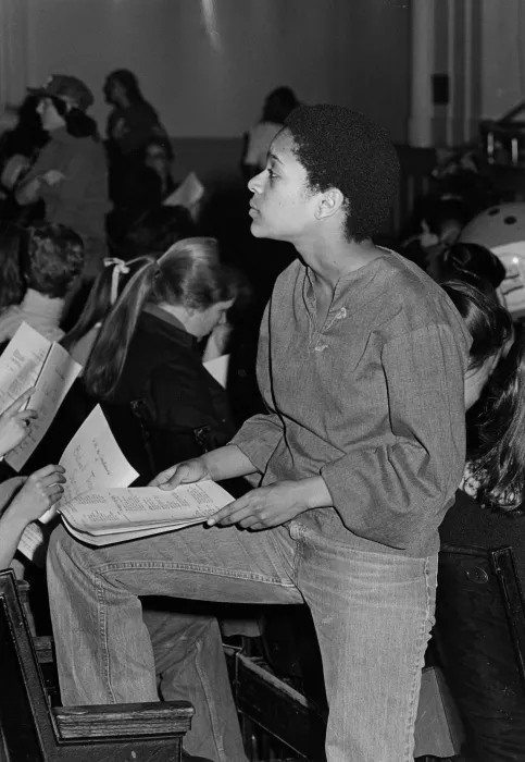 Student standing in John M. Greene Hall, 1981.