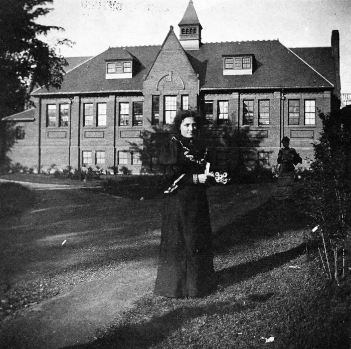Senda Berenson in front of Alumnae Gymnasium